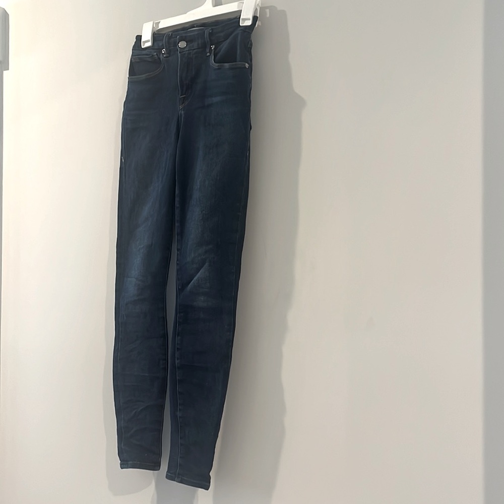 Good American slanted button top skinny jeans
